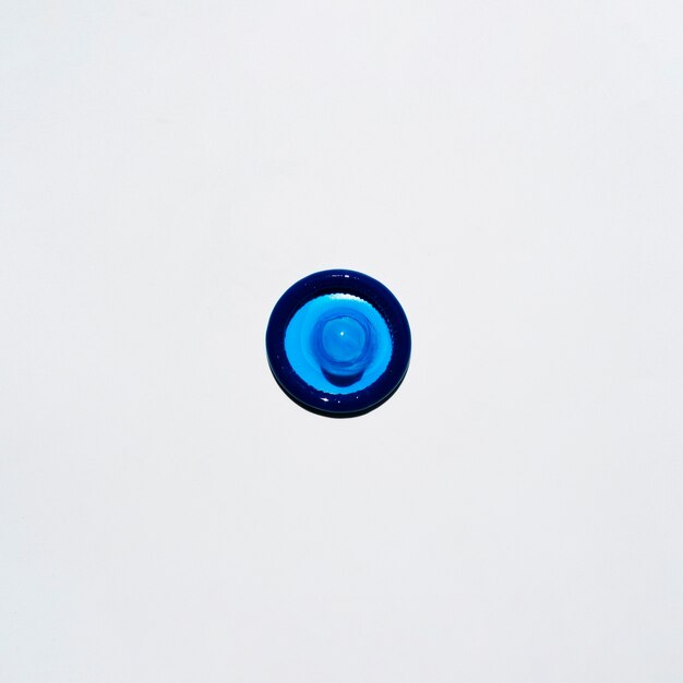 Top view blue condom on white background