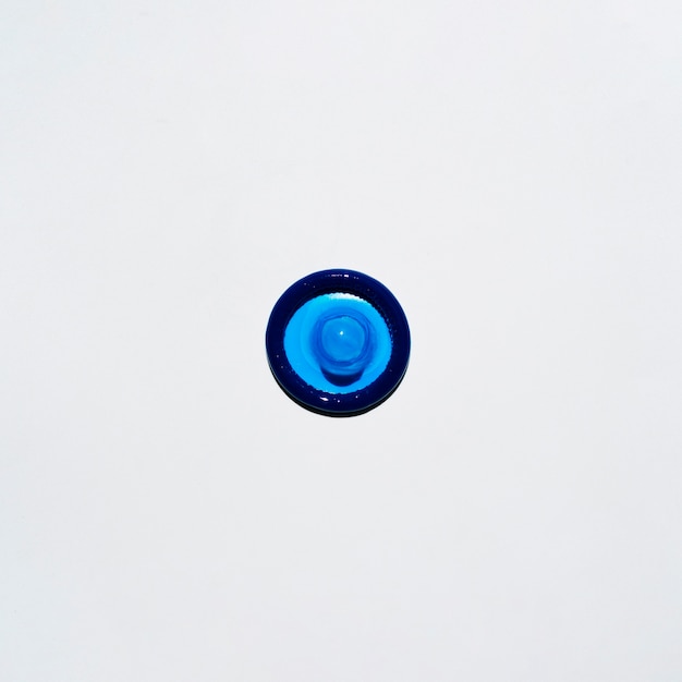 Top view blue condom on white background