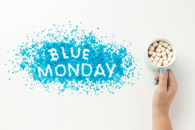 Top view blue monday composition with a mug