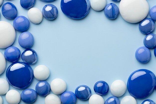 Top view blue monday concept composition with marbles