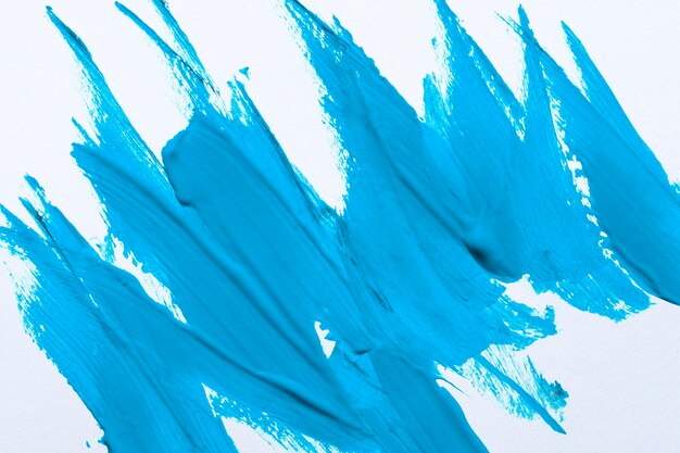 Top view of blue paint brush strokes on surface