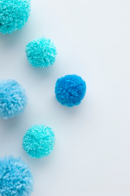 Top view blue pom poms arrangement