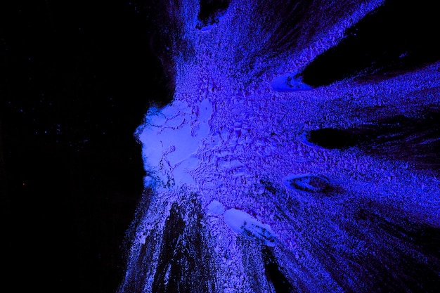 Free photo top view of blue powder color spread on plain surface