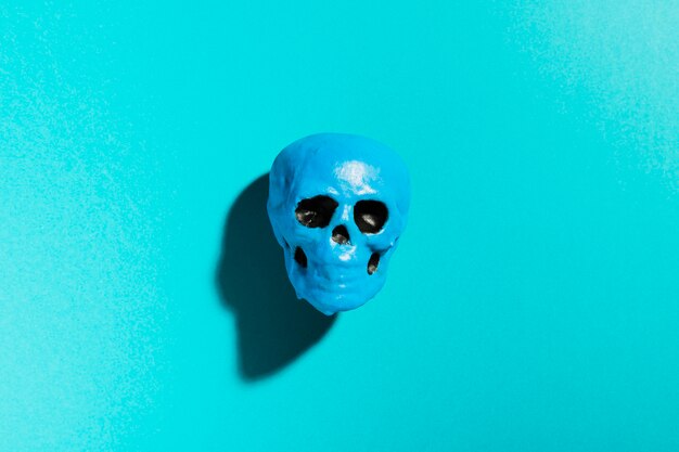 Top view blue skull on blue background