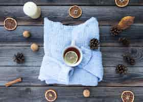 Free photo top view blue sweater on wooden background