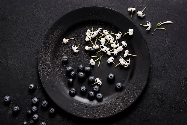 Top view blueberries on dark plate