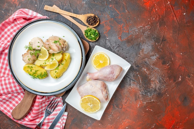 Top view boiled chicken with cooked potatoes and lemon on dark background cuisine dish oil color food meat calorie photo dinner