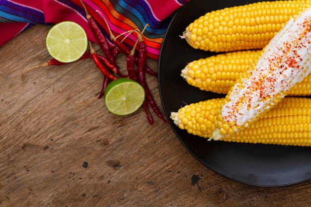 Top view boiled corn with chili powder