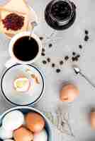 Free photo top view boiled egg and coffee cup d