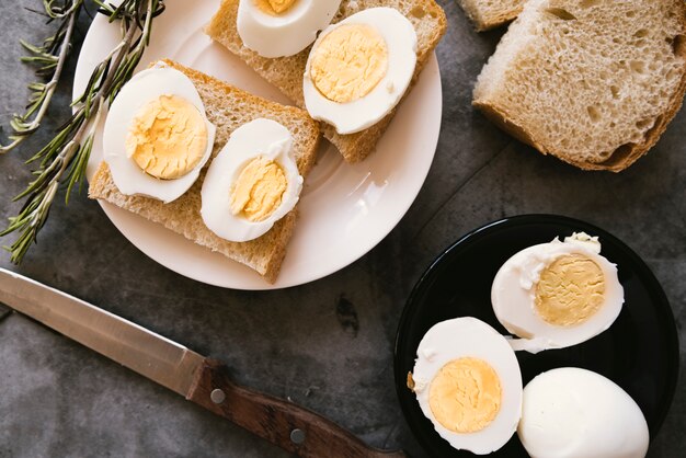 Top view boiled eggs and toast breakfast