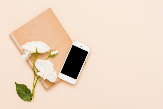 Top view of book and flowers