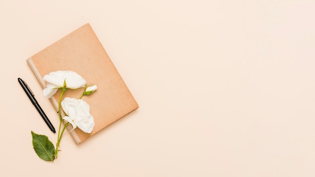 Top view of book and flowers