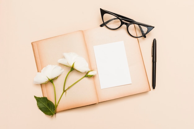 Top view of book and flowers