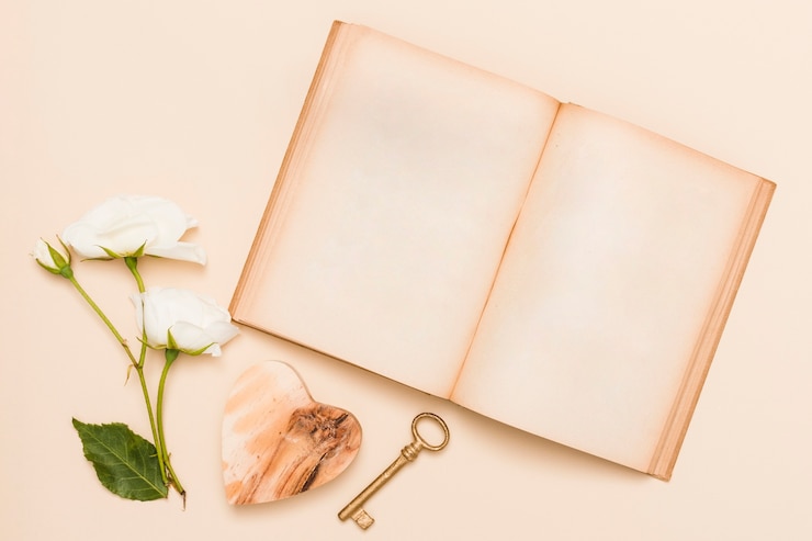 Free Photo top view of book and flowers