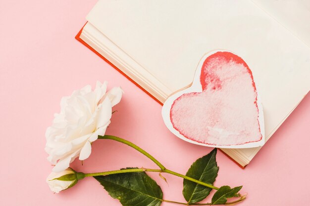 Top view of a book with a heart shape card