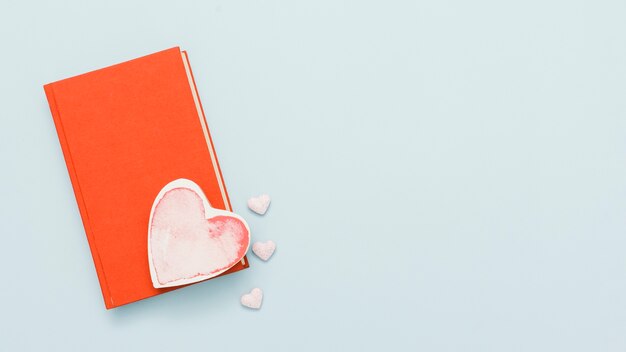 Top view of a book with a heart shape card