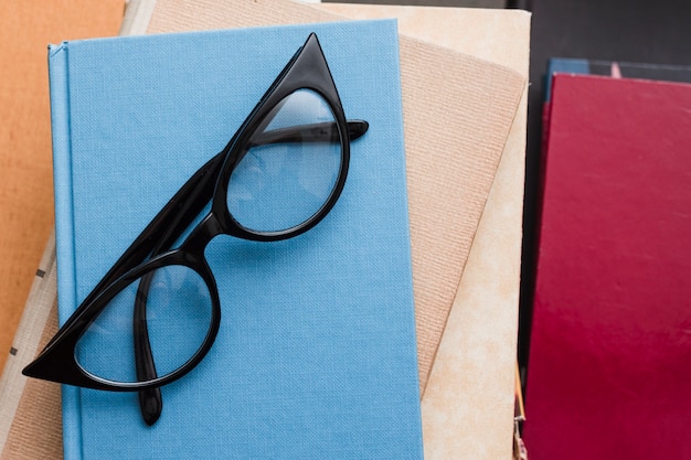 Free photo top view of books and glasses