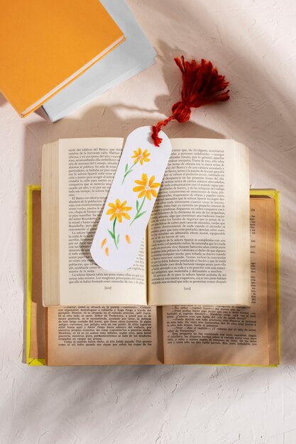 Top view books with floral bookmark