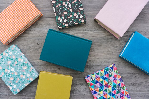 Top view of books on wooden surface