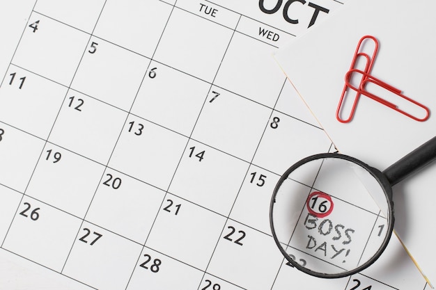 Top view boss's day assortment on calendar