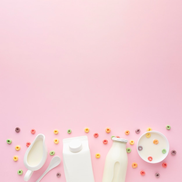 Top view bottle of milk with bowl and cereal