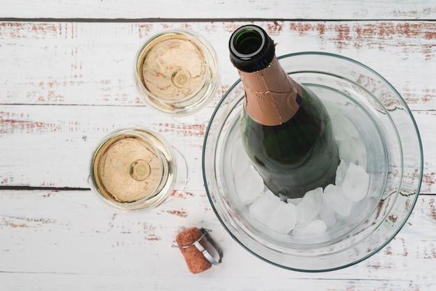 Top view bottle with champagne glasses