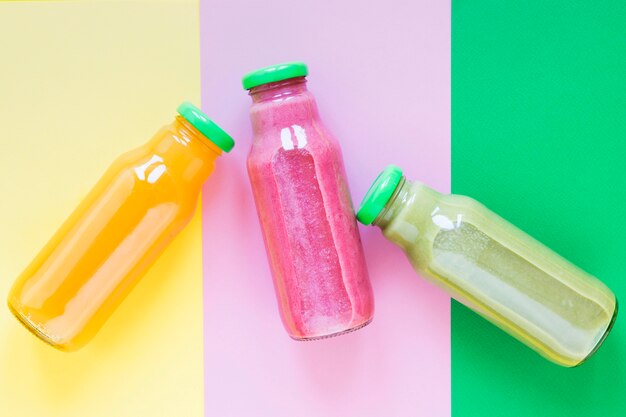 Top view bottles with smoothie on table