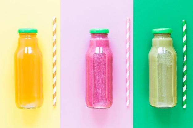 Free photo top view bottles with smoothie