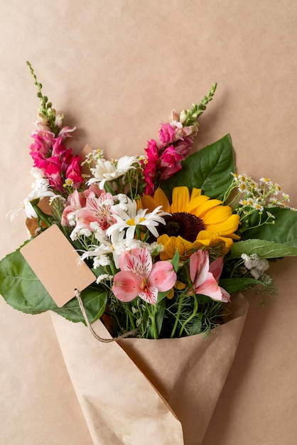 Top view of bouquet of flowers with blank card