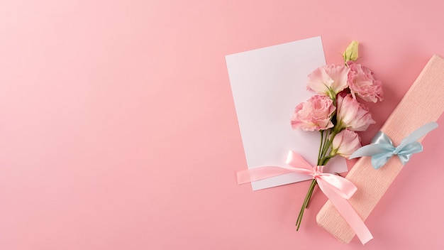 Top view of bouquet of flowers with blank card