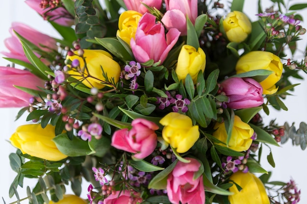 Top view of bouquet with pink and yellow tulips