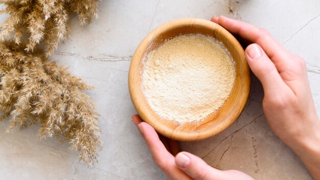 Top view of bowl of clay with flowers