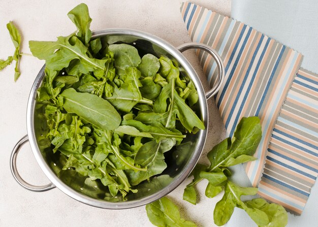 Top view of bowl of salad on cloth