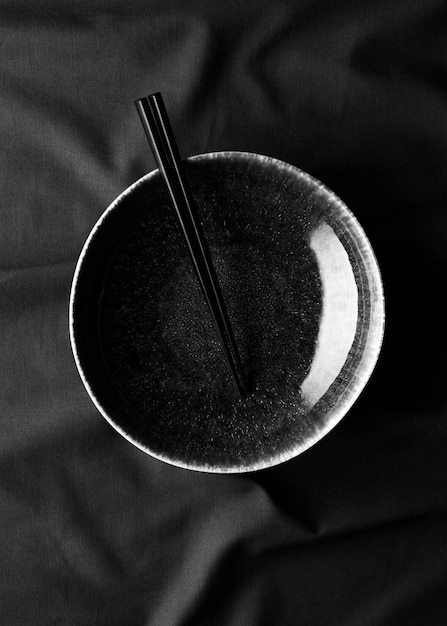 Top view of bowl with chopsticks