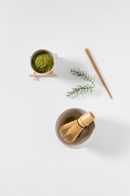 Top view bowl with matcha powder on the table