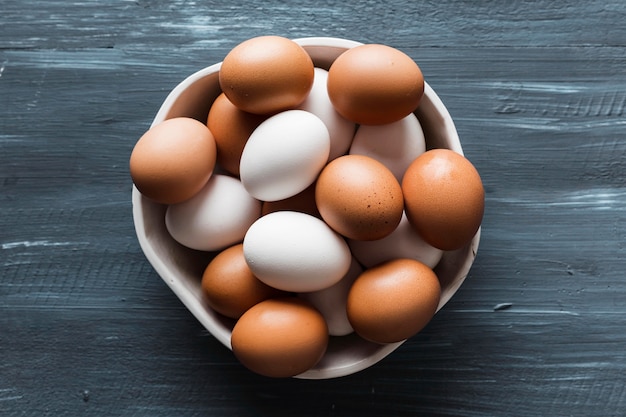 Free photo top view bowl with variety of eggs