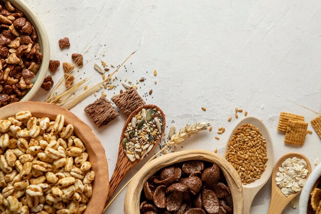 Top view of bowls with assortment of breakfast cereals