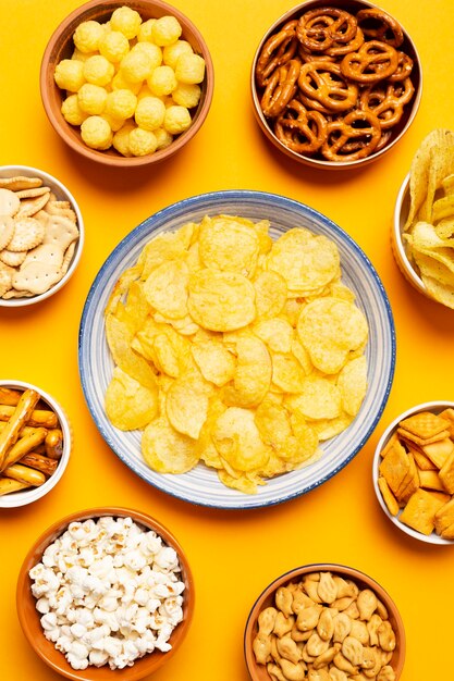 Top view bowls with salty snacks