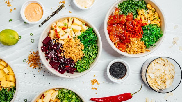 Top view of bowls with various healthy salads