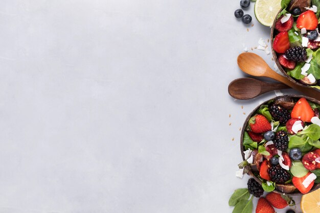 Top view bowls with veggies and fruit copy space