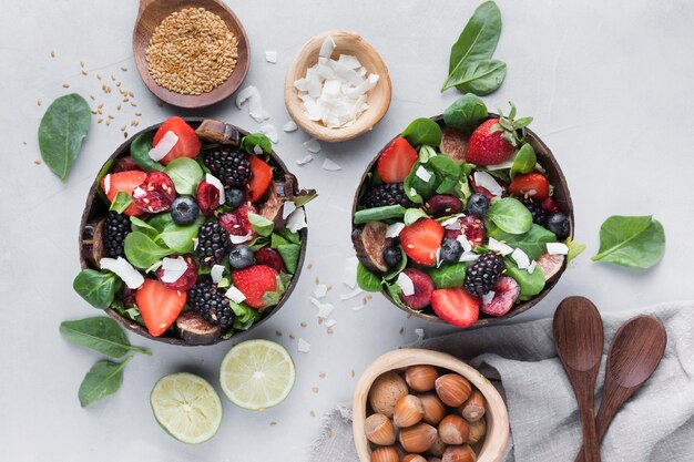 Top view bowls with veggies and fruit