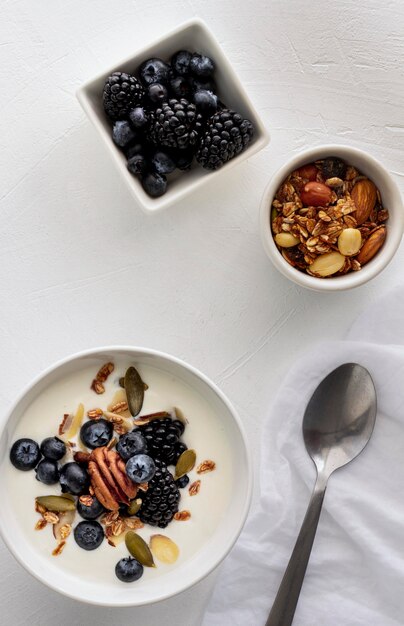 Top view bowls with yogurt and fruits