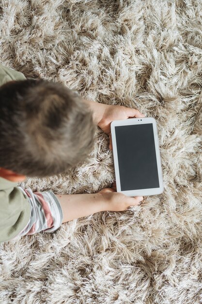 Top view of boy with smartphone template