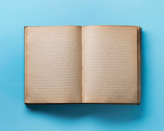 Top view braille book on blue background