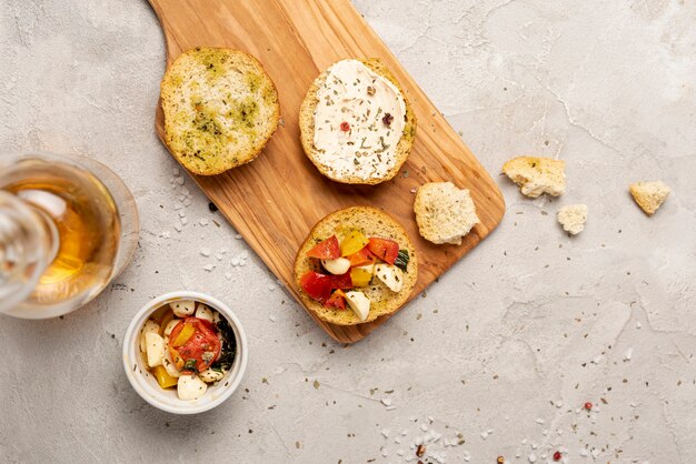 Top view of bread on chopper on plain background