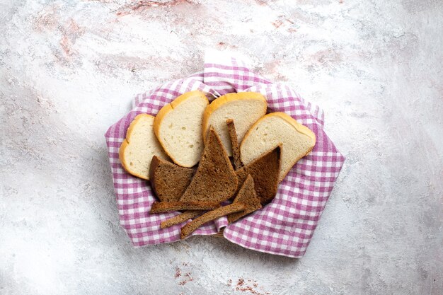 Top view bread loafs sliced bread pieces on a white desk bread bun meal food dough