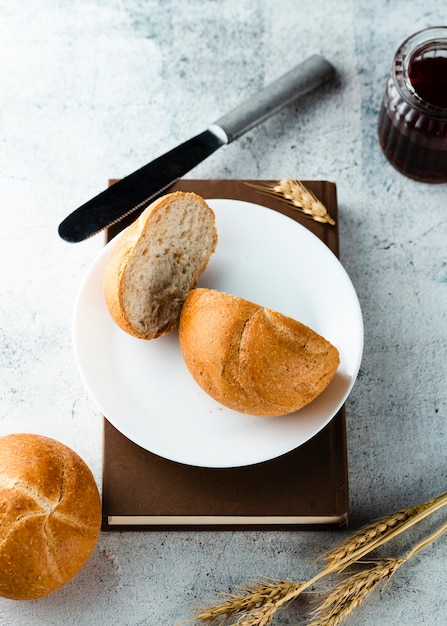 Top view of bread on plate on a book