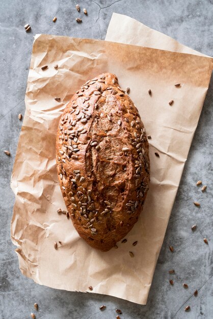 Top view bread with seeds on parchment paper