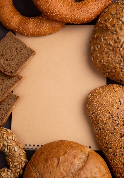 Top view of breads as cob bagel and rye bread slices with copy space