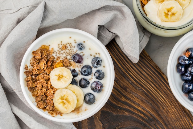 Top view breakfast bowl with granola and fruits
